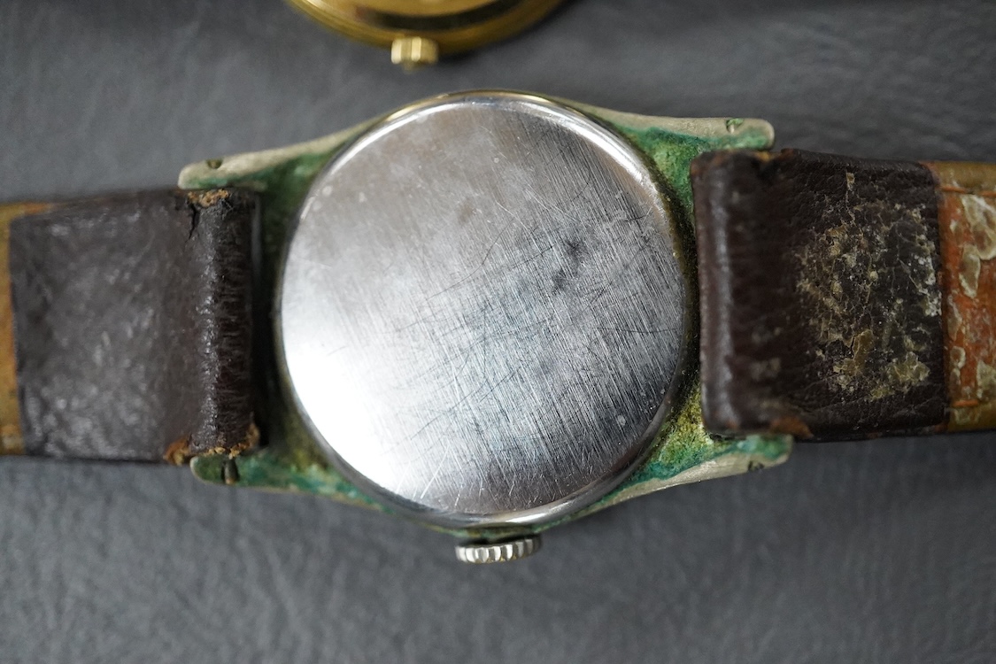 A lady's 18k Baume & Mercier quartz dress wrist watch, with Arabic dial, case diameter 27mm, the case back numbered 15602 1877944, on a Baume & Mercier black leather strap, together with a base metal Ralco manual wind wr